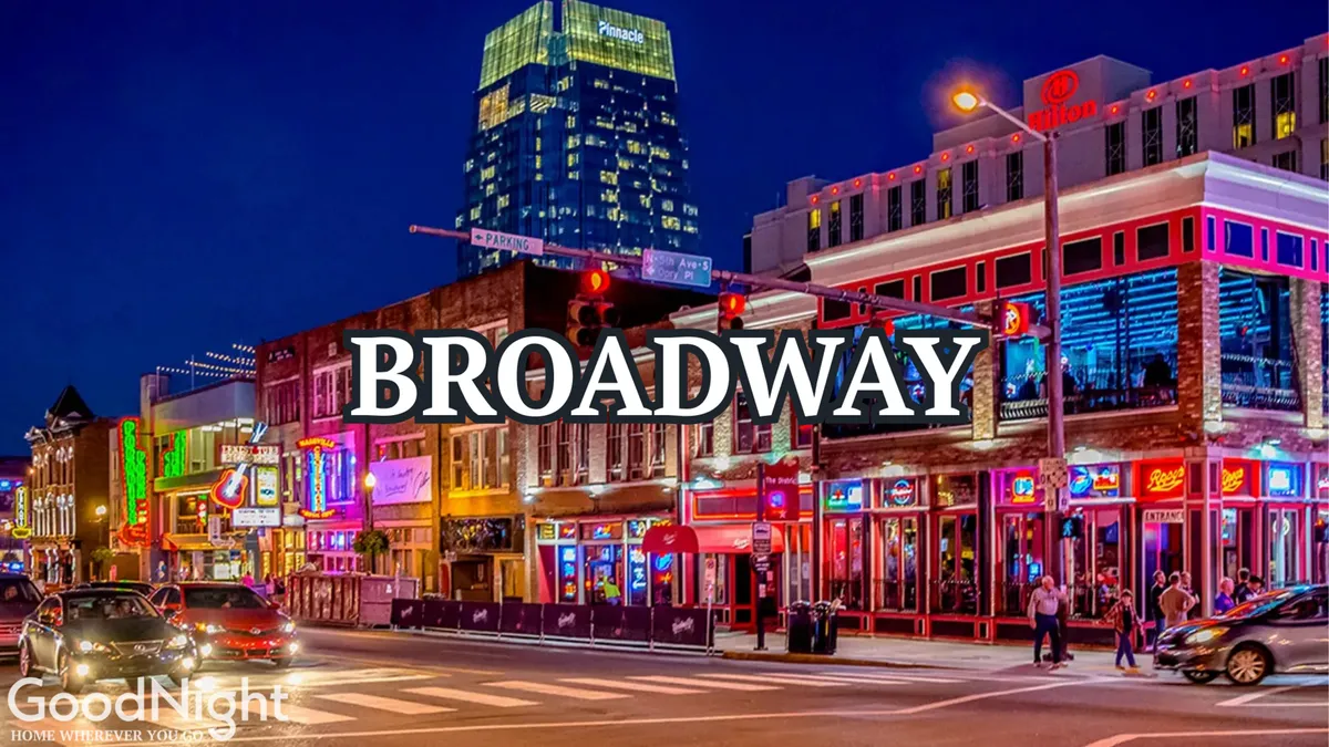 A vibrant Nashville street at night teeming with bright neon signs, bustling crowds, and people walking past music venues, restaurants, and shops. The energy of the city is palpable, with the scene capturing the essence of Nashville's famous nightlife and live music culture.